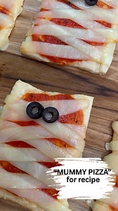 Crescent mummy pizzas are the perfect dish for Halloween. They are easy to make and scary good. 👻 | Miss Annie's Home Kitchen