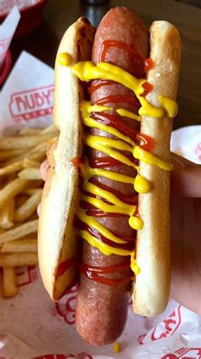 How about all three? 😏 Celebrate National Hot Dog Day with one (or all three) of our delicious hot dog menu items! 🌭 | Ruby's Diner