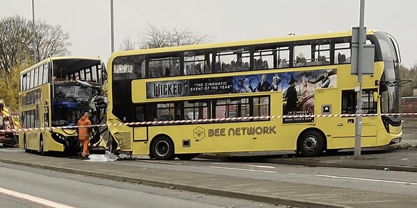 Manchester bus crash leaves at least 17 injured as air ambulance lands at scene