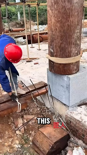 This worker uses a timber lever and rope to shift massive wooden pillars | Veronica Hogan