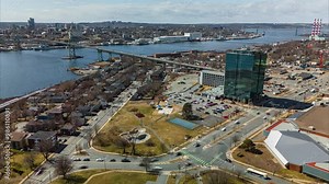 A Breathtaking Drone Hyperlapse Of Dartmouth City Center, Highlighting The Busy Streets And Skyscrapers, With Halifax And Its Bay Seen In The Background.