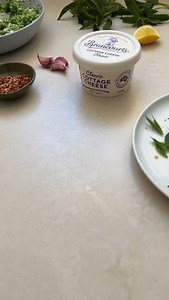 Crushed Pea, Cottage Cheese & Poached Egg Tartine with mint, chili & lemon This is one of my favourite meals to make for a healthy & delicious breakfast, brunch or lunch! Makes 4 toast some extra crushed pea mix to use another day. Ingredients 2 ½ cups frozen peas Zest 1 lemon Pinch dried chili flakes Salt, pepper Handful dill, roughly chopped Handful mint, roughly chopped 1 x 250g tub Cottage Cheese 4 thick slices sourdough 2 tbsp olive oil 1 tbsp white vinegar 4 free range eggs To serve, extra