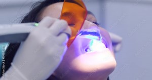 Dental restoration and material polymerization with UV light