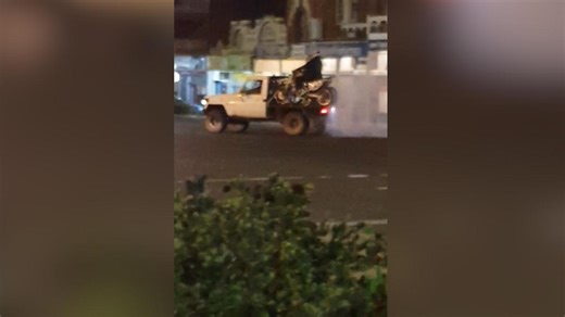 WATCH: motorbikes do burnouts on the back of a moving ute in Kalgoorlie