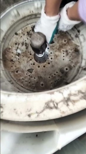 An easy way to remove the washing machine drum Nut using an electric drill socket. #washing #repair