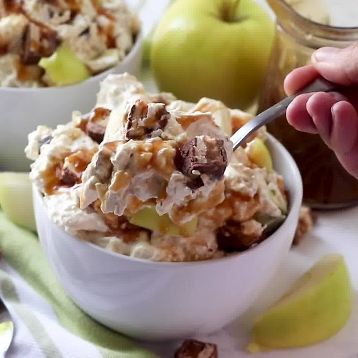 464K views · 921 reactions | Snickers Caramel Apple Salad is made with chopped Snickers bars and apples draped in a pudding and cool whip mixture then drizzled with caramel sauce! RECIPE HERE: https://www.thecountrycook.net/snickers-caramel-apple-salad/ | The Country Cook | Facebook