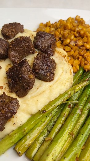 Cowboy Butter Steak & Potatoes RECIPE: https://badbatchbaking.com/cowboy-butter-steak-and-potatoes/ This Cowboy Butter Steak and Potatoes is easy enough to be a weeknight dinner but sophisticated enough to serve to company. Tender cajun garlic butter steak bites are piled on top of decadent cheesy mashed potatoes and then it all gets smothered in lemon-garlic cowboy butter. #cowboybutter #steakandpotatoes #garlicbutter #easydinnerideas | Bad Batch Baking by Mallory Austin