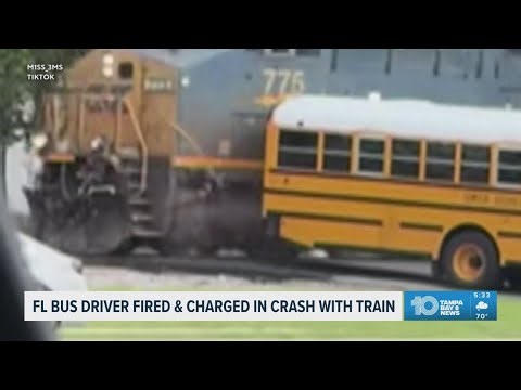 Florida school bus driver fired, charged in crash with train