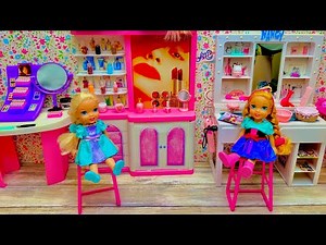 Elsa and Anna toddlers help at Barbie's salon