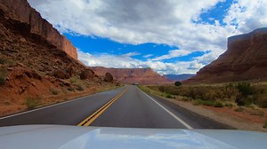 Utah State Route 128. Utah State Route 128, known as the Upper Colorado River Scenic Byway, is a 44.6-mile scenic highway northeast of Moab that offers breathtaking views of the Colorado River, red rock canyons, and towering sandstone cliffs. This remote and winding route is a popular tourist destination and a must-do drive for its dramatic desert scenery, numerous pullouts, and access to Fisher Towers. Please note all photos, videos and reels on this page were taken by myself and my wife on our