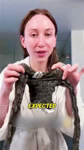 The girl's sweater shrunk after washing, and is now only a fraction of its original size