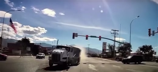 Runaway double-bottom semi takes out 33 cars as it barrels into dealership [UPDATED VIDEO]
