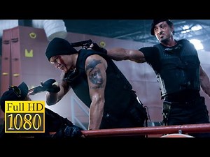 Sylvester Stallone and Jet Li punish Dolph Lundgren in the movie The Expendables (2010)