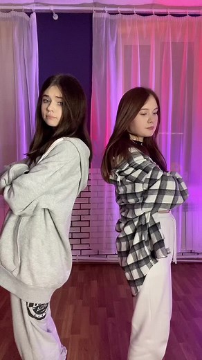 Synchronized Dance Routine in Stylish Indoor Setting