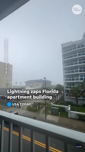 Video shows the shocking moment lightning strikes an apartment building's roof during a thunderstorm in Jacksonville, Florida. | The Commercial Appeal