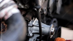 replacing the water pump of the car engine cooling system, a new aluminum car spare part pump.
