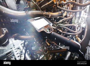 Inspection of a gas turbine engine using a Video Endoscope. Search for defects inside the turbine and shooting on video, photos using a measuring inst Stock Photo - Alamy
