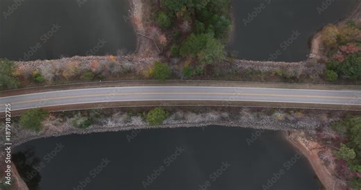 Roadway passing through falls lake in Wake County, North Carolina.