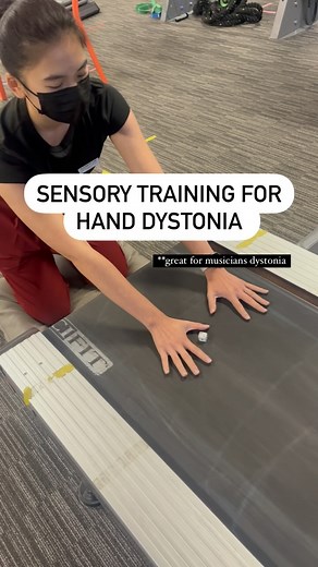 Dr. Julie Hershberg on Instagram: "Sensory training for hand dystonia ✋ **especially helpful for musicians dystonia (but also writers cramp or any type of hand dystonia) In this example we set up sensory training for a person with excessive finger flexion and adduction as dystonic movements. I love this one first using the treadmill for sensory input to relax the hand And then working on an externally focused finger abduction by catching the die between the fingers. Sensory and motor training al