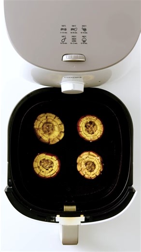 As it cooks, this apple opens up like a flower! Air fryer caramel blooming apples: https://www.taste.com.au/recipes/air-fryer-caramel-blooming-apples-recipe/jv91ouoh | Taste.com.au