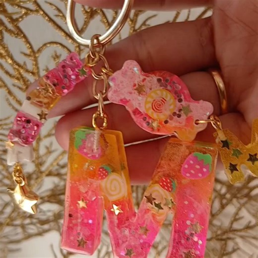 MMI Resin creations on Instagram: "Sweet Treat Keychain Indulge in our adorable candy-themed keychain, featuring a colorful candy cupcake design with pink accents and juicy strawberries! At the center of this treat is a 3D candy charm that's sure to satisfy your sweet tooth. *Keychain Features:* - Candy cupcake design with pink and strawberry details - Hanging name charm for a personal touch - Mini alphabet charm to make it extra special - Candy-shaped charm to add a playful touch **Get your swe