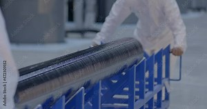 Silicon crystal and ingot used for solar panel cell is taken to processing. Factory that produces panels for solar energy. Clean energy