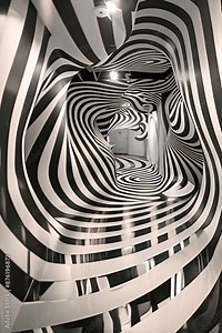 Black and White Illusion Tunnel: A mesmerizing optical illusion of a black and white striped tunnel, creating a sense of depth and distortion, perfect for architecture, design, and abstract concepts.
