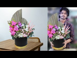 Pink color flowers arrangement in a box