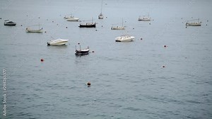 Yachts and boats floating in a bay. Sea landscape with boats on a horizon. Summer time, vacation.