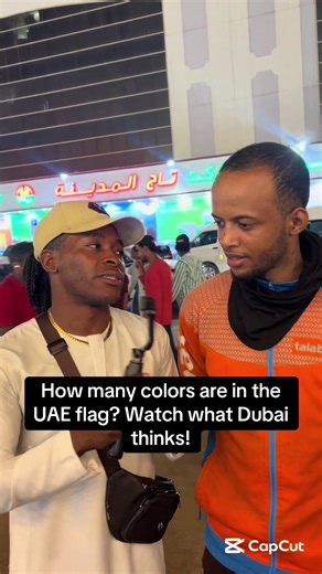 Can you guess how many colors are in it? Let me know in the comments! — /: Follow for more street interviews and fun trivia! #UAEFlag #DubaiTrivia #StreetInterview #PublicQuiz #trendingInDubai .