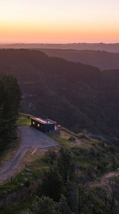 Perched on a northwest-facing ridge, Highview in Taranaki offers sweeping panoramic views where native bush meets farmland. Watch red and fallow deer roam the valley below, catch glimpses of Mount Taranaki and the west coast ocean on clear days, and listen for kiwis calling through the night. Spend your evenings in the wood-fired hot tub under a canopy of stars, and if you visit in autumn, you might hear the stags' roar echoing across the valley. This is off-grid living at its finest—complete wi