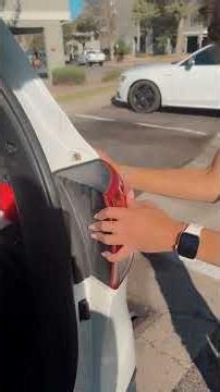 Girl changes brake light on car automotive maintenance and repair