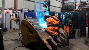 Reinforcing excavator bucket with precision welding