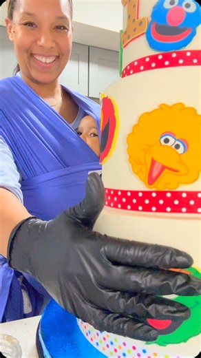 Brianna Collins | First birthday cake! Zo peeking is my favorite part | Instagram