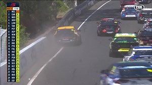 First lap... FIRST CRASH! Things aren't looking great for Tim Slade, who went right into the fence. Bathurst LIVE: https://bit.ly/2MbcyDX | FOX Sports Australia