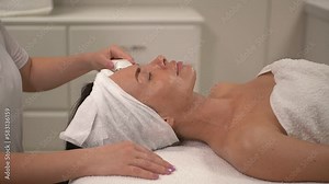 the master performs the procedure using a microcurrent device for the face. slow motion video. close-up of the client's face. High-quality Full HD video recording Stock Video