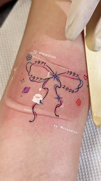 Exploring Infinite Ribbon Tattoo Art by Tew