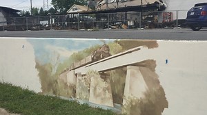 Altavista mural painted in front of destroyed Altavista Appliance