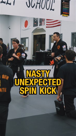 Kyoshi walks the RSKA team through the Extended Spinning Axe Kick, a variation that combines height, control, and directional cutting motion. Unlike the traditional axe kick that lifts and drops straight down, this version cuts at an angle after a vertical lift, landing with precision and power. The key is to bring the leg up to the front, not the side, then sharply cut across the target. This movement prevents telegraphing and increases impact accuracy. Kyoshi emphasizes proper stance, pad plac