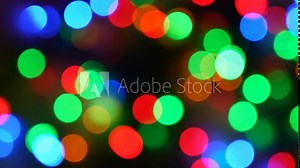 abstract christmas background: vibrant, glowing Christmas lights captured in bokeh style, creating a festive, dreamy effect, colorful lights in soft focus, ideal for holiday themes and backgrounds
