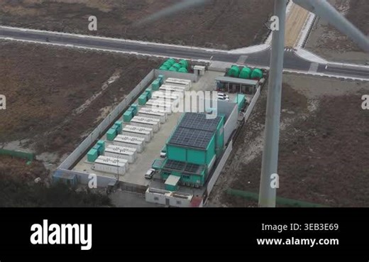 Aerial drone view of a battery energy storage system at a wind power site in Taiwan, highlighting electricity storage, grid balancing, congestion relief, and clean energy transition.