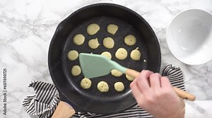 Flat lay. Step by step. Frying mini pancake cereal in a nonstick frying pan.
