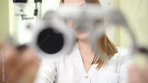 ophthalmologist with trial frame for selection of glasses, examination