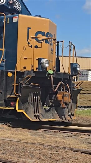 CSX L011 coupling up to their train