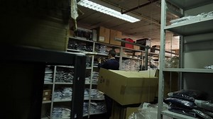 Store attendant in clothing warehouse - Free Stock Video Footage | Coverr