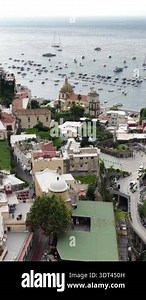 Positano Italy aerial view captures colorful houses and buildings cascading down to the clear blue Mediterranean Sea Stock Video Footage - Alamy