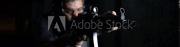 Front view of Person Aiming and Firing HK SP5K, High-Speed German Assault Rifle Shooting