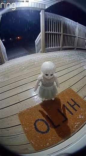 Frozen Doll Breaks Free During Ice Storm