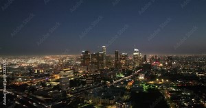 Illuminated streets downtown Los Angeles skyline at twilight dusk night. Aerial view. Los Angeles at Dusk. Aerial view of Los Angeles downtown city night skyline. LA valley California cityscape night