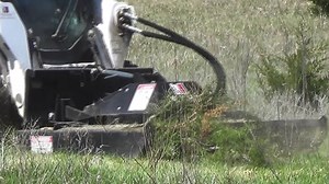 Watch as our Power Mower Attachment goes beast mode on a pasture full of cedar trees. Find this and over 100 different skid steer attachments on our site at www.triplesproducts.com or call 308-987-2397. Habla espanol? Llame a Ariel Martinez al 720-774-9274. | Triple S Products